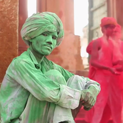 Indian man covered in green coloring