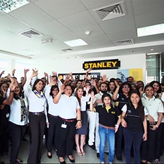Stanley Black and Decker employees waving